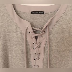 Long sleeve, lace front. Lightweight gray top.